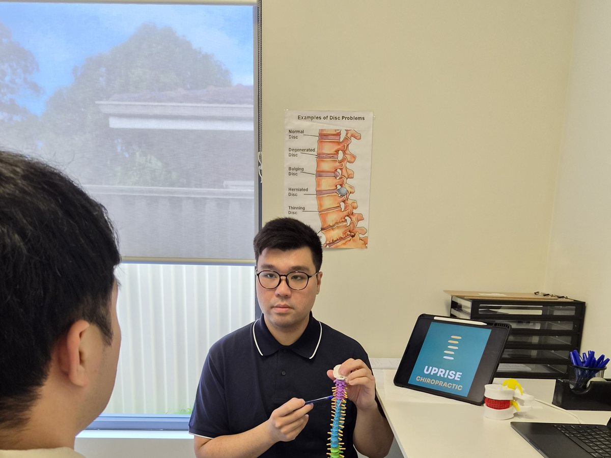 Dr Norris Leung with a patient at Uprise Chiropractic, Byford